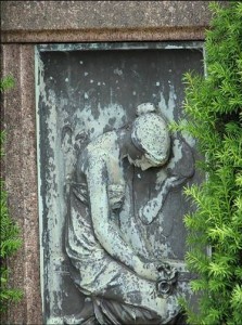 A kneeling woman mourning her loss