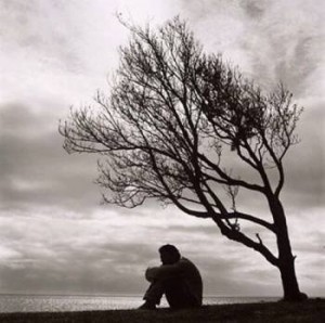 Man Grieving under a tree